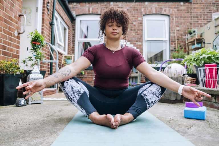 Yoga teacher demonstrating butterfly pose